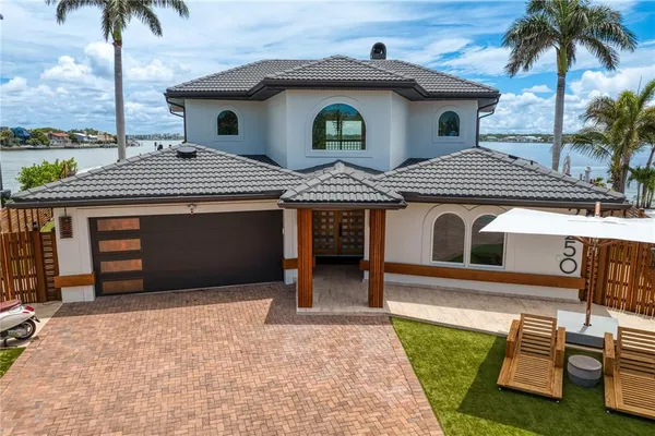 a front view of a house with garden