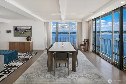 a view of a dining room with furniture window and wooden floor