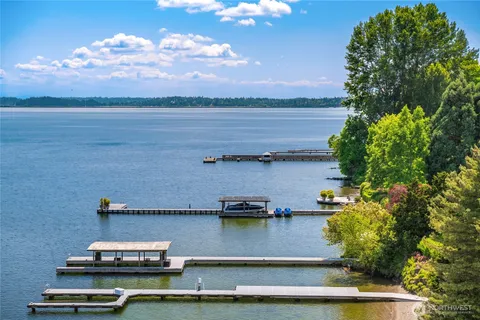 a view of a swimming pool with an outdoor seating and a garden