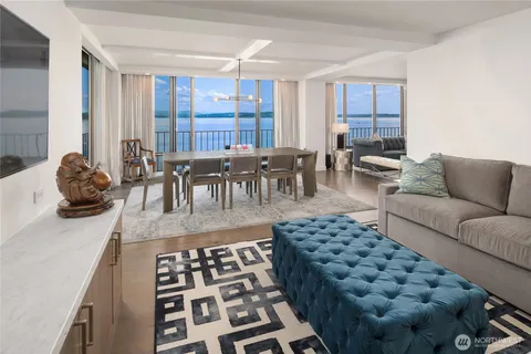 a living room with furniture and a rug