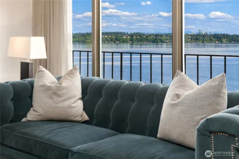 a living room with couch and a large window