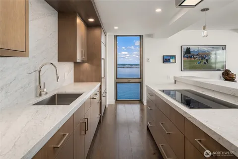a kitchen with a sink and a stove top oven