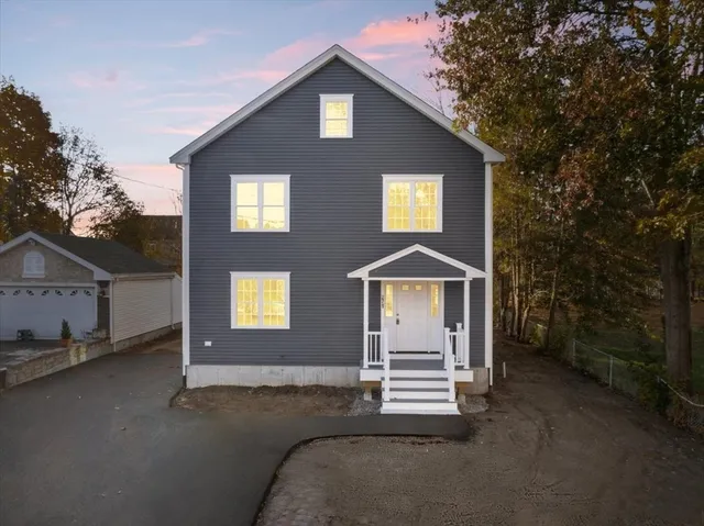 a front view of a house with a yard