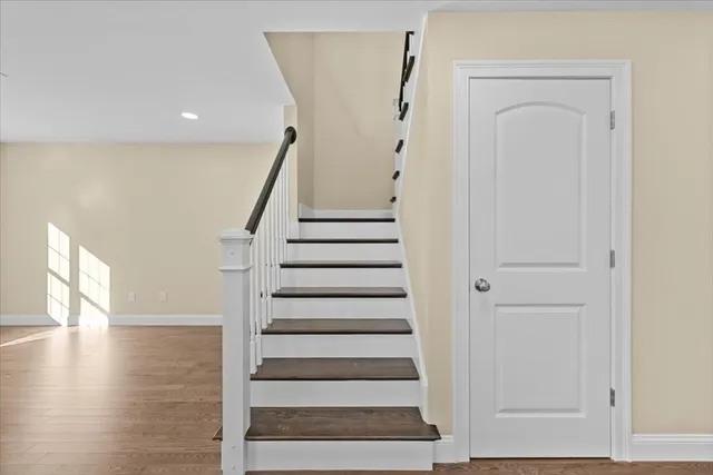an empty room with wooden floor