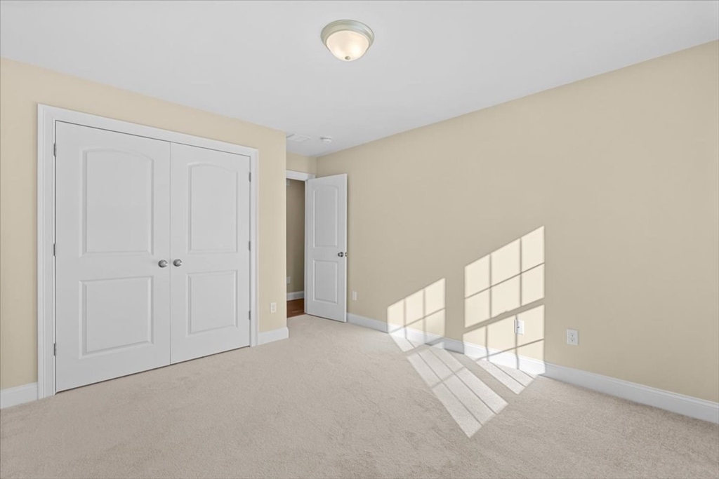 271 Ames Street Brockton, MA 02302 - Photo 32 of 40 an empty room with windows and closet