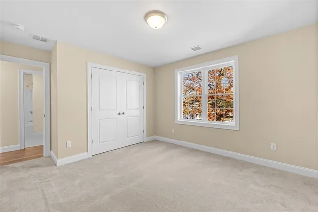 a bathroom with a granite countertop toilet a sink and a bathtub