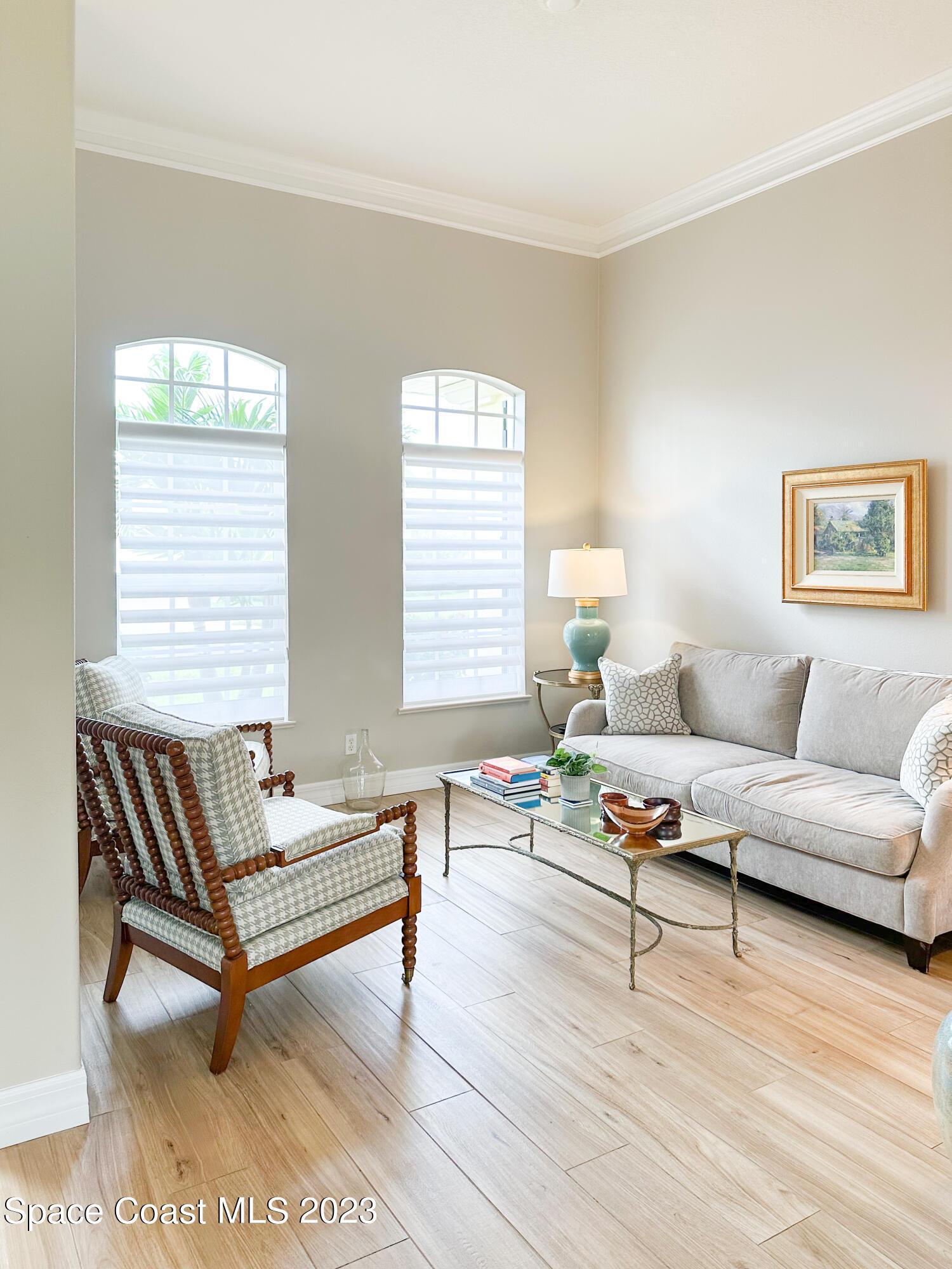 245 Clyde Street Melbourne Beach, FL 32951 - Photo 25 of 88 a living room with furniture and a wooden floor