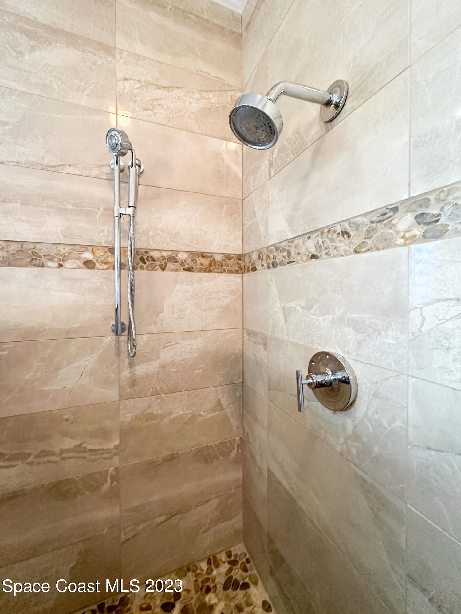 245 Clyde Street Melbourne Beach, FL 32951 - Photo 47 of 88 a bathroom with a shower