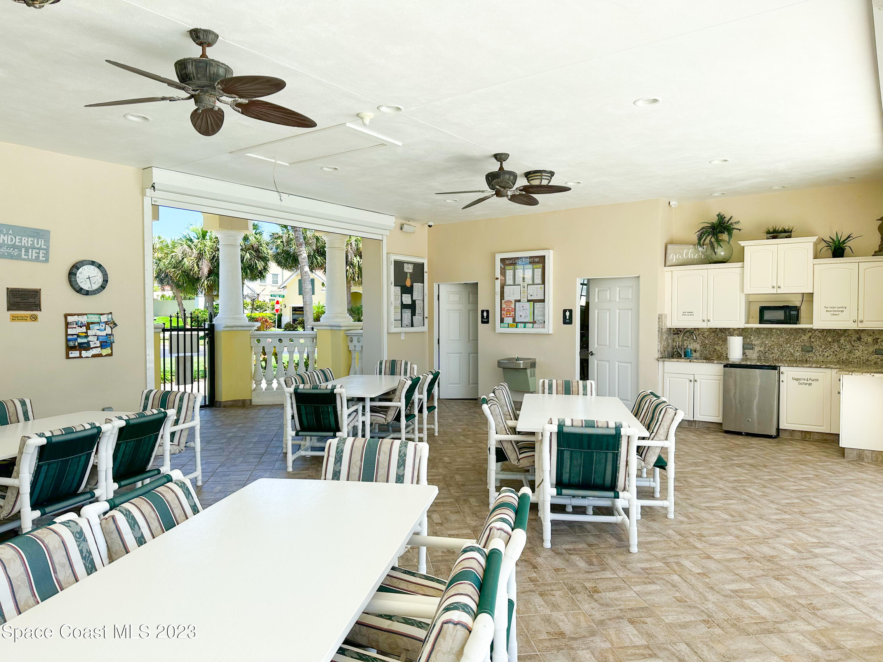 245 Clyde Street Melbourne Beach, FL 32951 - Photo 80 of 88 a view of a dining room with furniture window and outside view