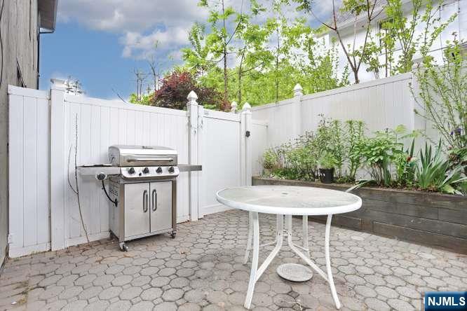 290 Hamilton Place, Unit 4 Hackensack, NJ 07601 - Photo 46 of 50 a outdoor dining space with furniture and a stove