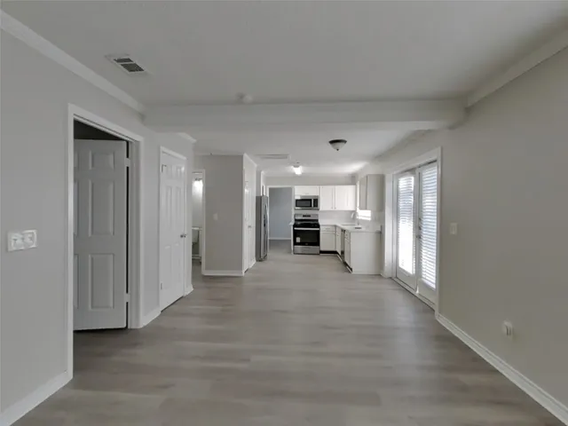 a view of a livingroom with a kitchen