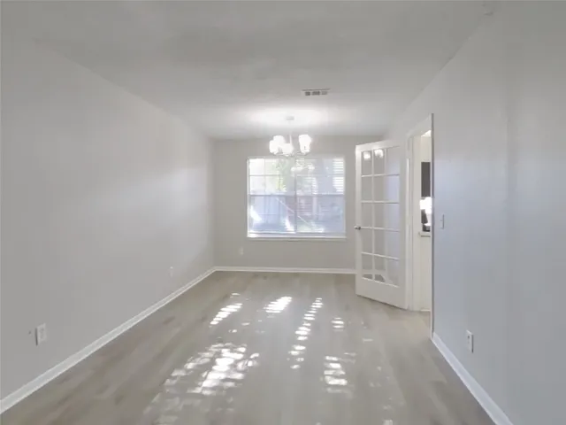 a view of a room with large windows