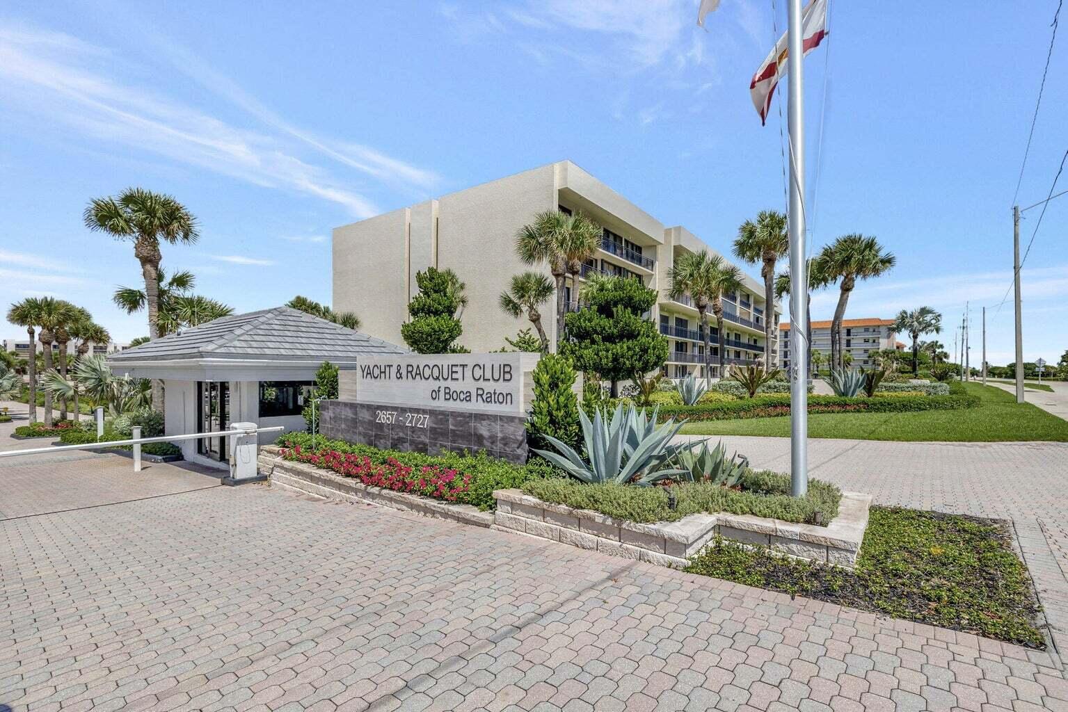 2707 North Ocean Boulevard, Unit D205 Boca Raton, FL 33431 - Photo 30 of 51 a sign board with flower plants in front of it