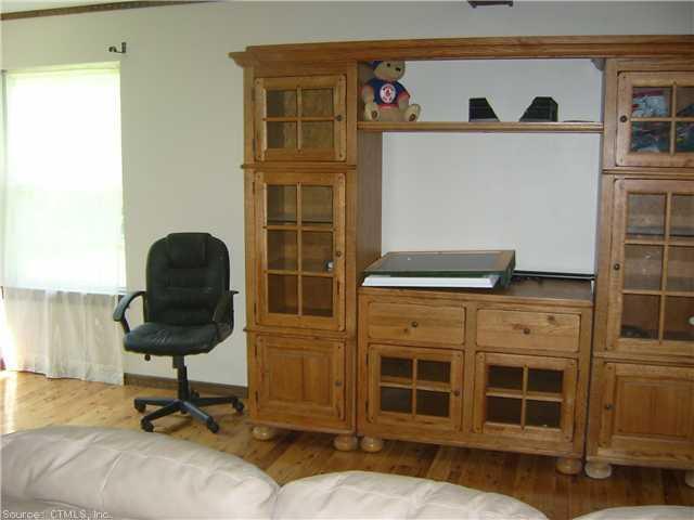 471 Kemp Road Scotland, CT 06247 - Photo 1 of 1 a living room with furniture and a window