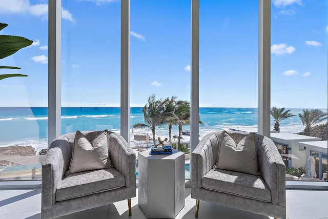 a living room with furniture and outdoor view