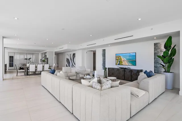 a living room with furniture and a table