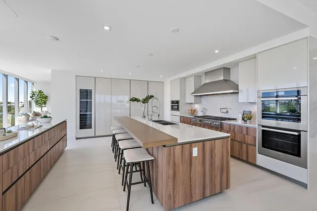 a kitchen with stove and cabinets