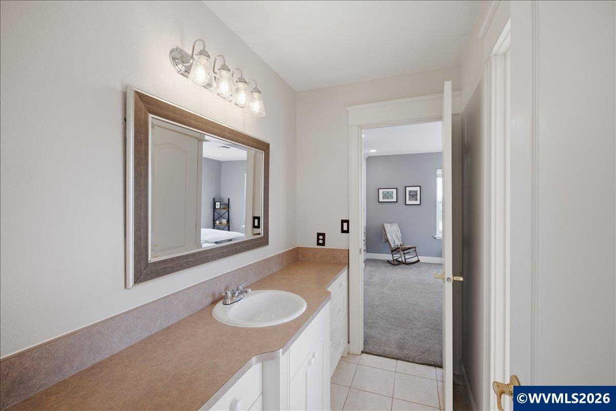 1492 Northwest Penny Lane Albany, OR 97321 - Photo 34 of 50 a bathroom with a sink and a mirror