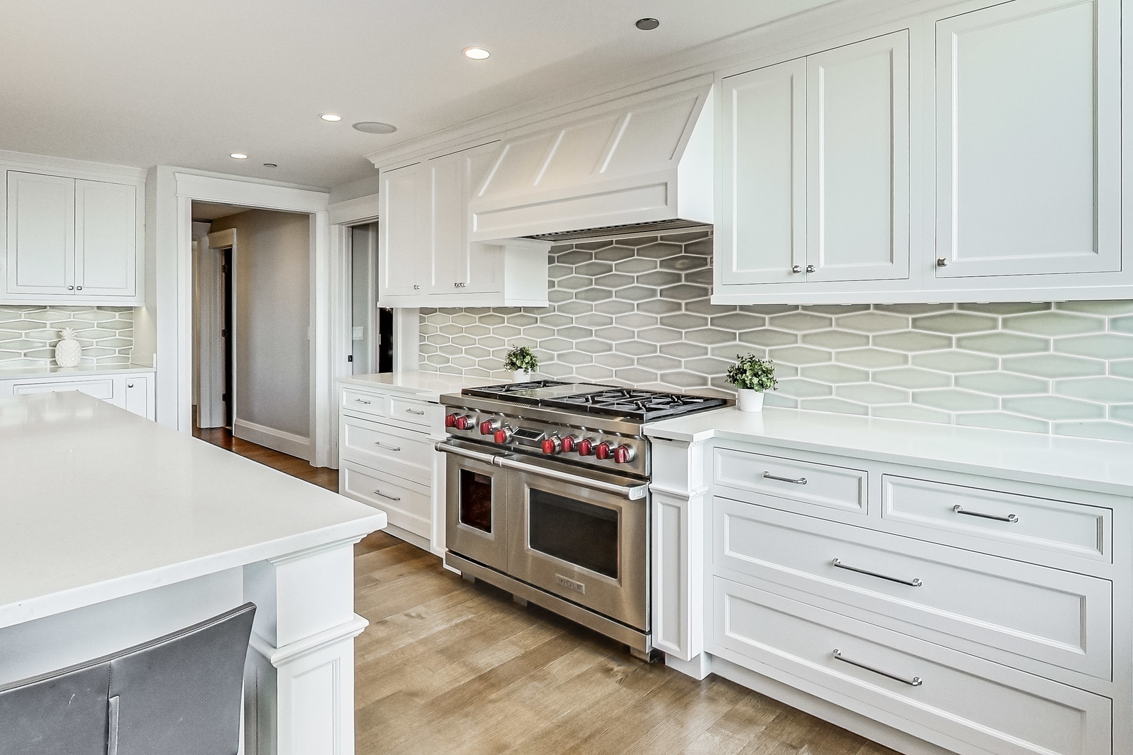 55 West Delaware Place, Unit 620 Chicago, IL 60610 - Photo 22 of 48 a kitchen with granite countertop white cabinets and stainless steel appliances
