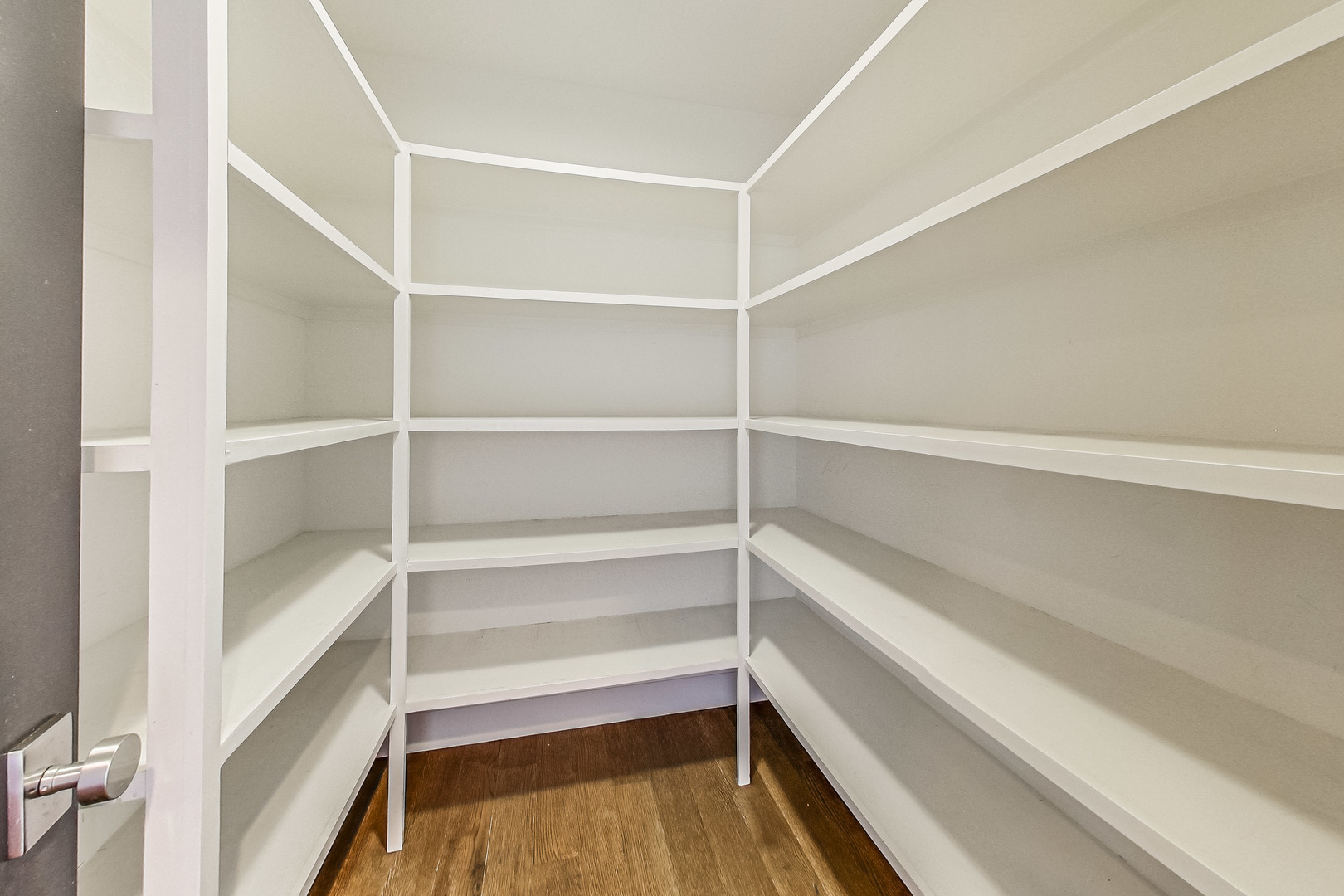 55 West Delaware Place, Unit 620 Chicago, IL 60610 - Photo 23 of 48 a storage room with wooden floor