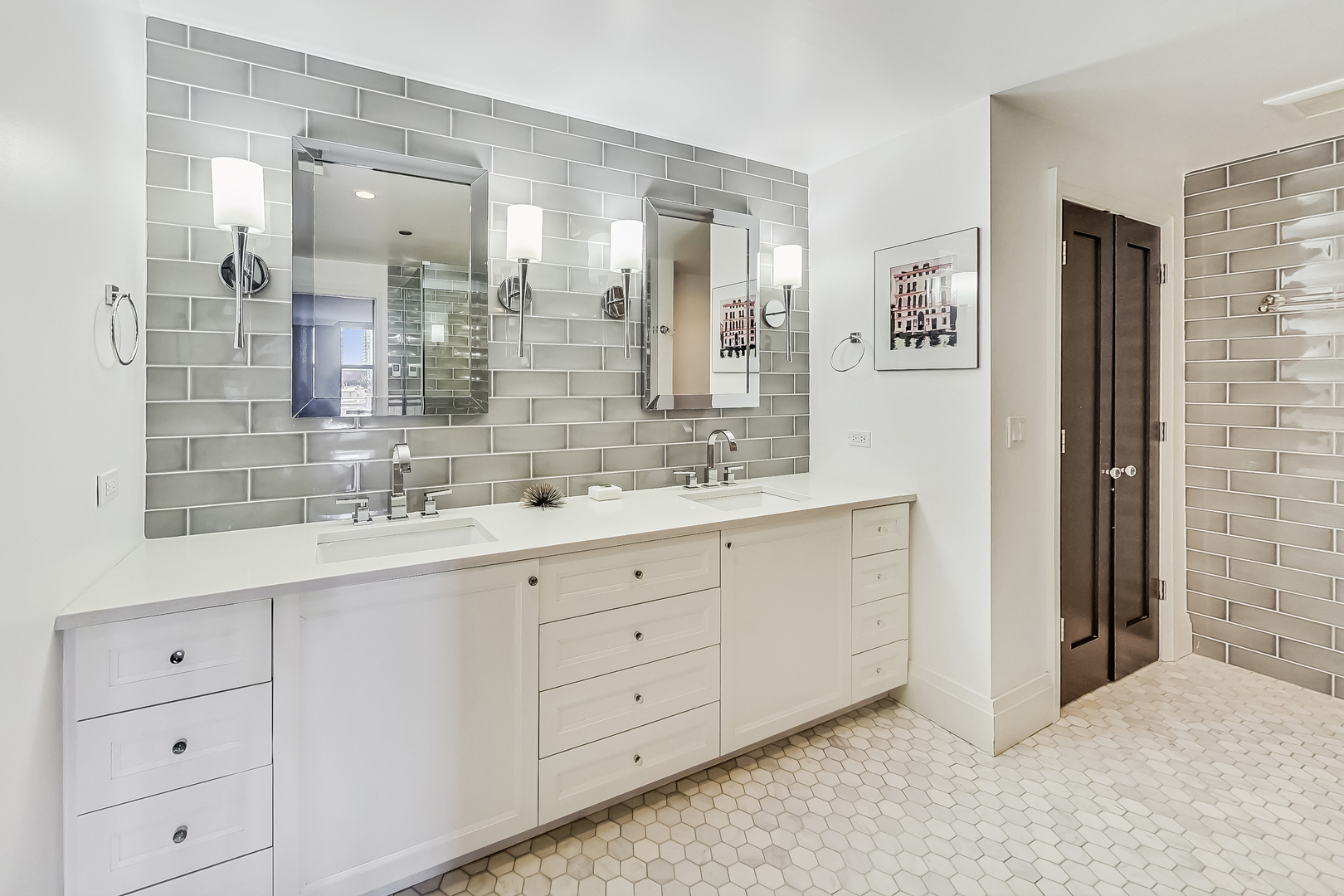 55 West Delaware Place, Unit 620 Chicago, IL 60610 - Photo 27 of 48 a bathroom with double sink and a mirror