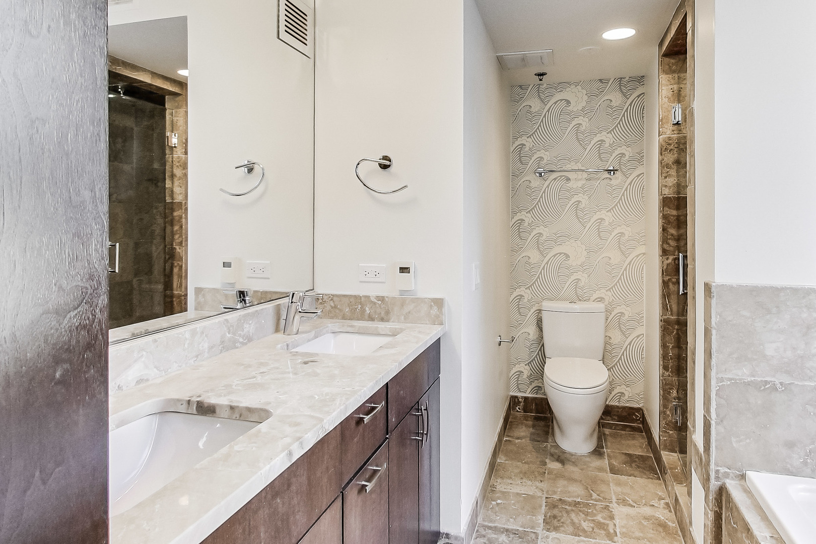 55 West Delaware Place, Unit 620 Chicago, IL 60610 - Photo 31 of 48 a bathroom with a granite countertop sink a toilet and shower