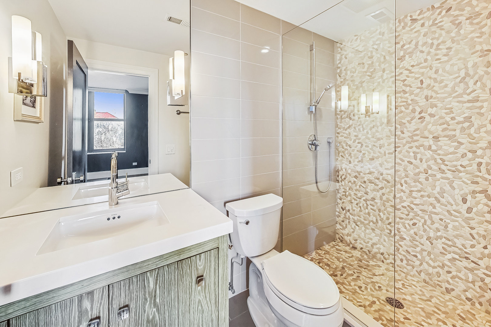 55 West Delaware Place, Unit 620 Chicago, IL 60610 - Photo 35 of 48 a bathroom with a sink a toilet and shower