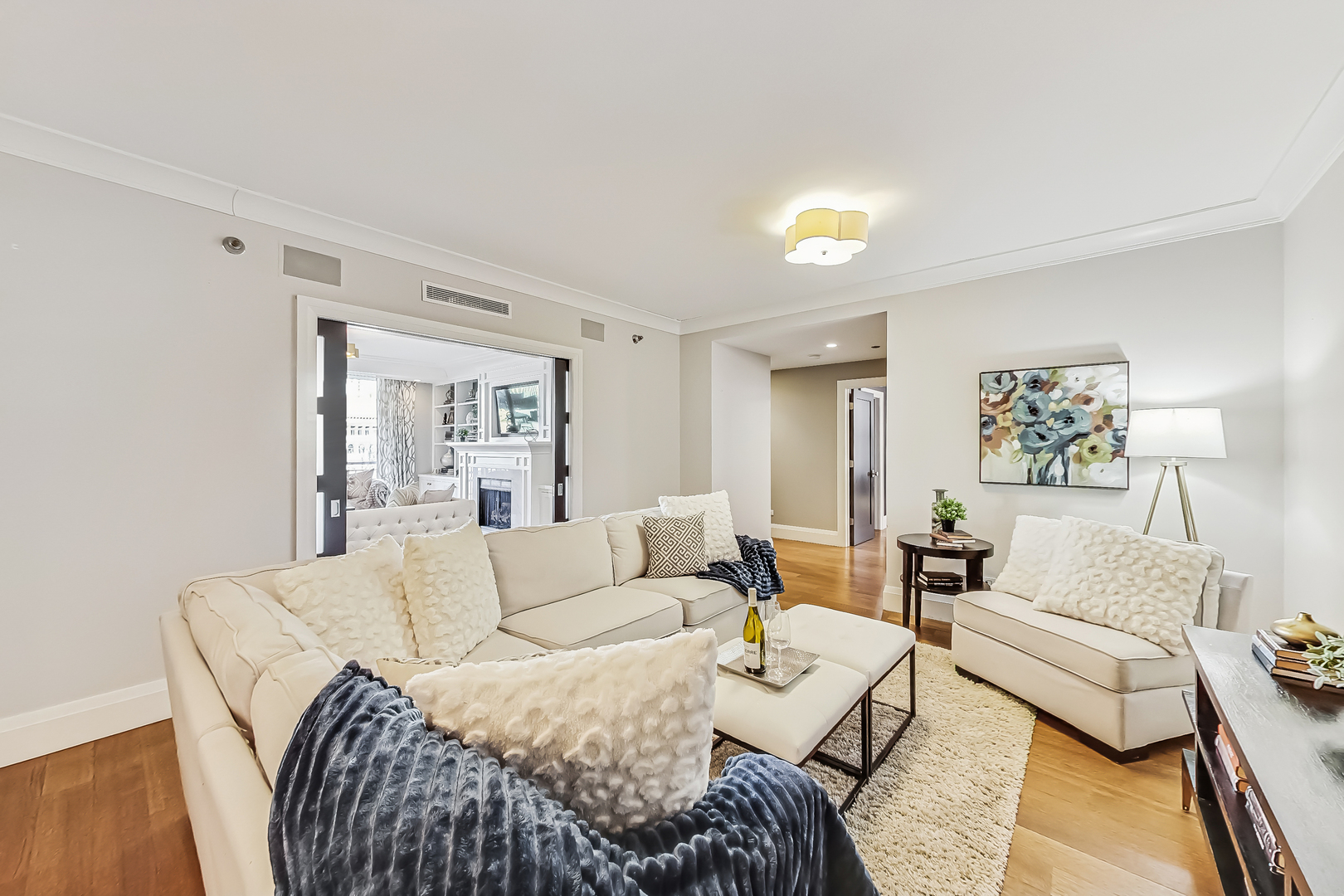 55 West Delaware Place, Unit 620 Chicago, IL 60610 - Photo 40 of 48 a living room with furniture and a lamp