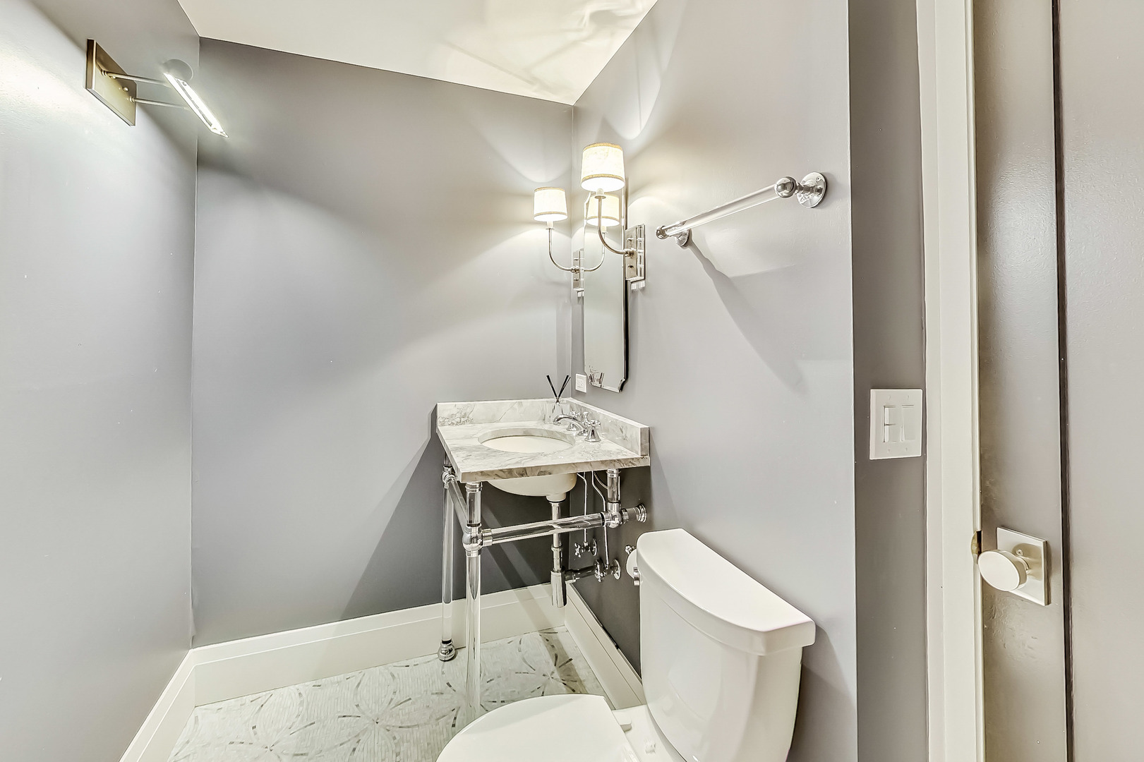 55 West Delaware Place, Unit 620 Chicago, IL 60610 - Photo 44 of 48 a bathroom with a sink a toilet and shower
