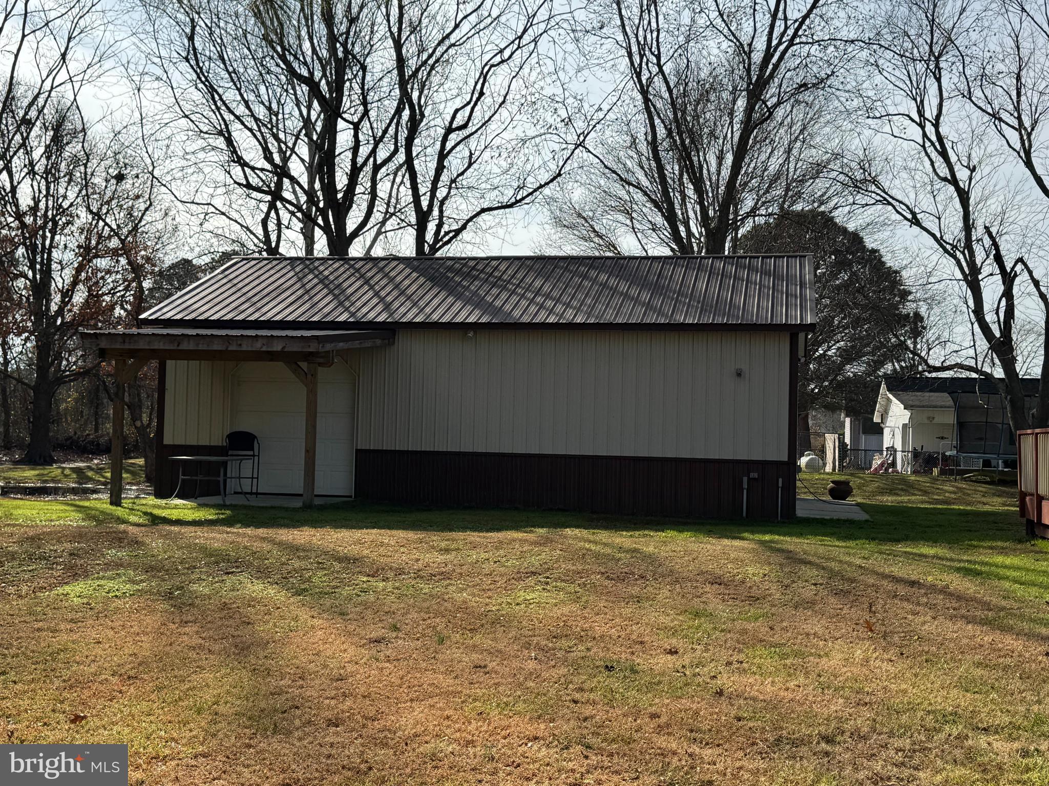 26759 Old State Road Crisfield, MD 21817 - Photo 14 of 17 a front view of a house with a yard