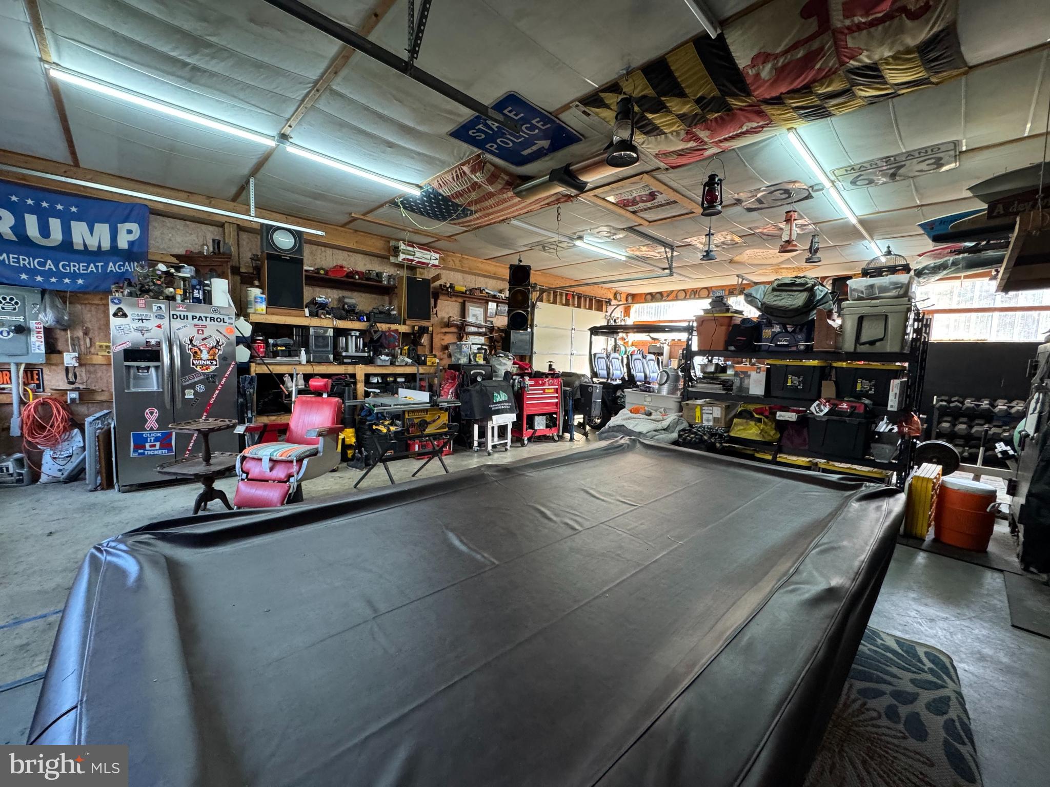 26759 Old State Road Crisfield, MD 21817 - Photo 16 of 17 a view of a garage with storage