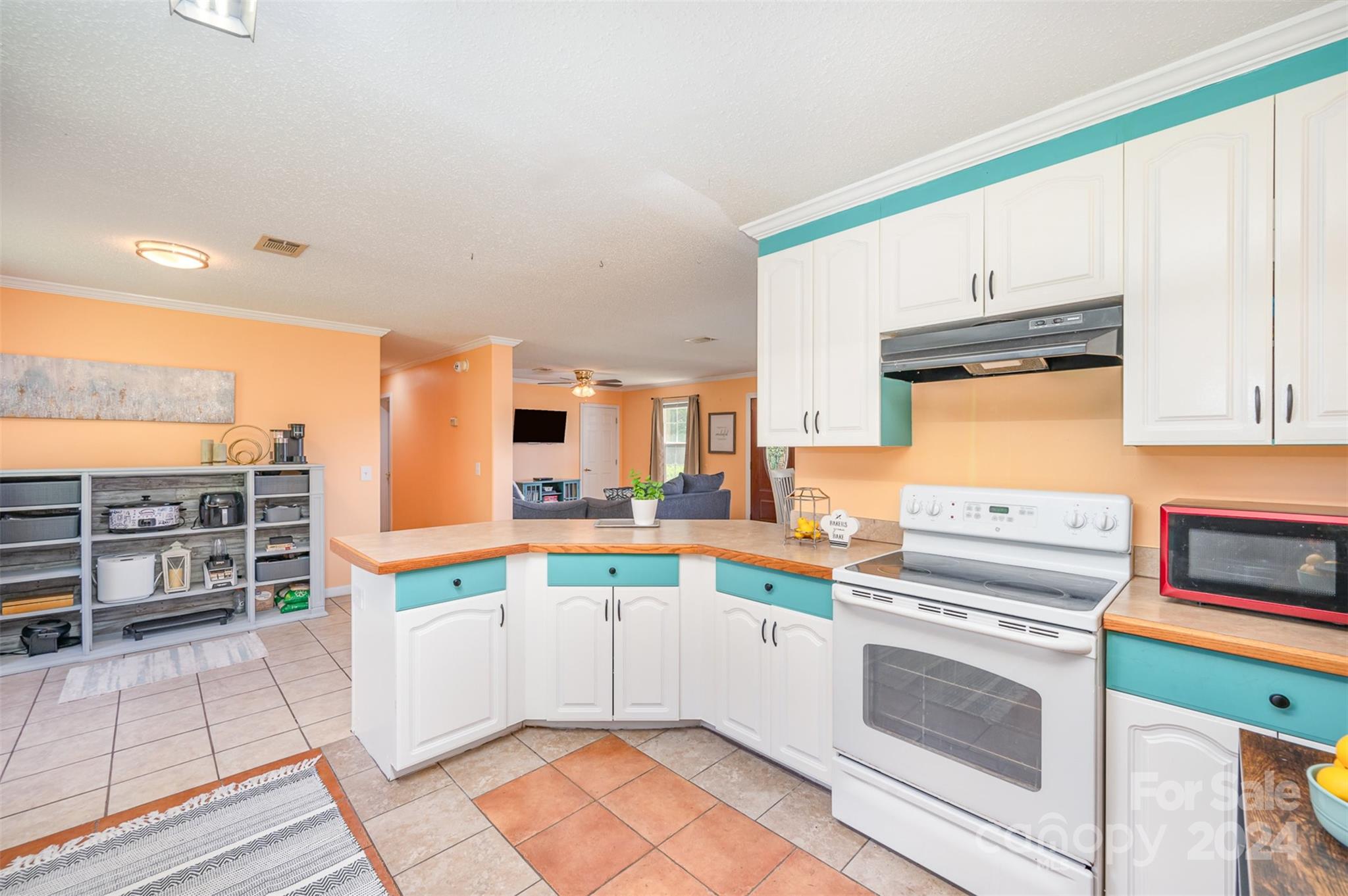 408 Rhea Road York, SC 29745 - Photo 16 of 34 a kitchen that has a lot of white cabinets and a wooden floor