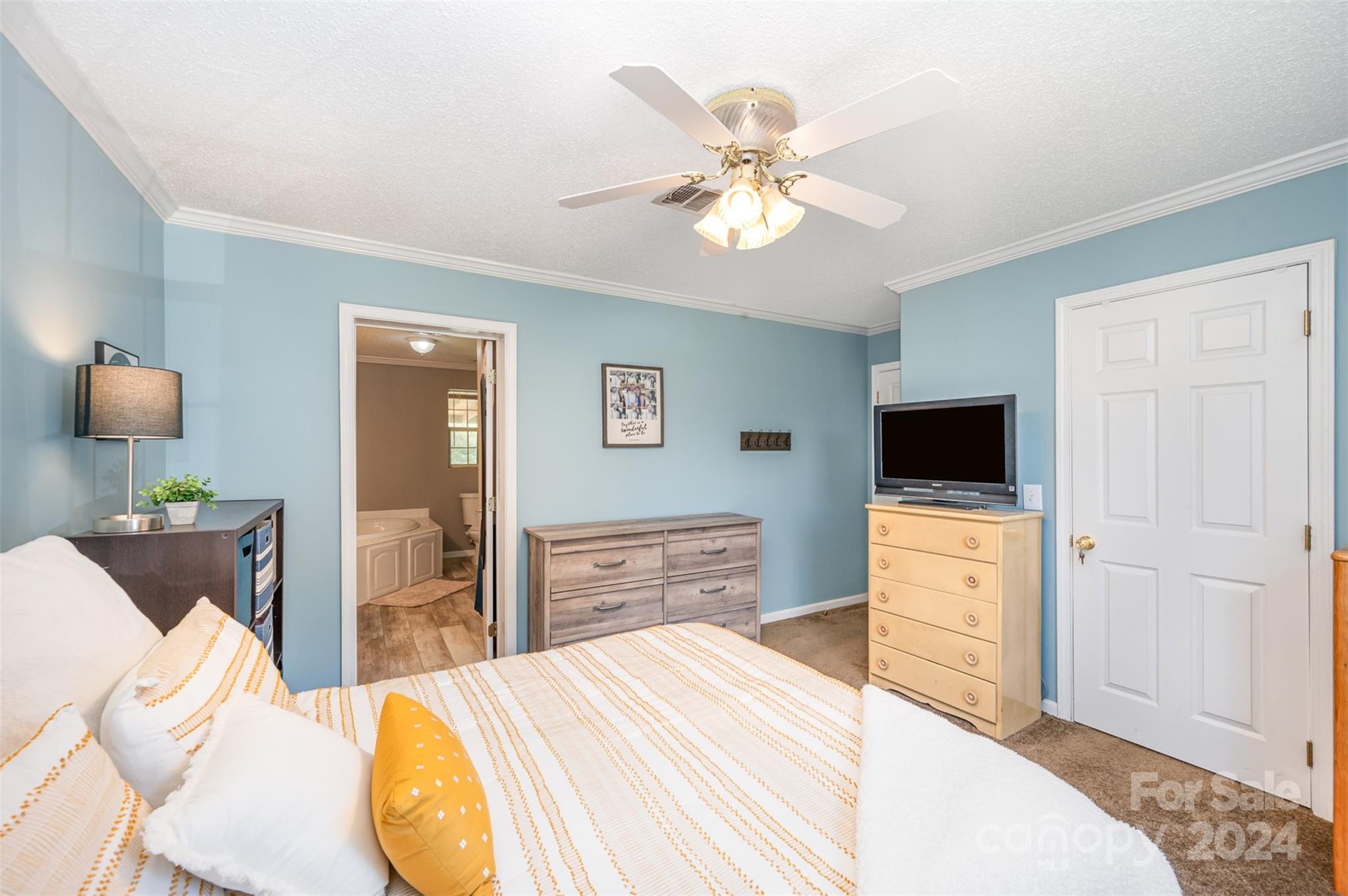 408 Rhea Road York, SC 29745 - Photo 18 of 34 a bedroom with a bed and wooden floor