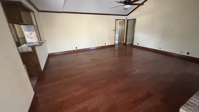 a view of an empty room with stairs