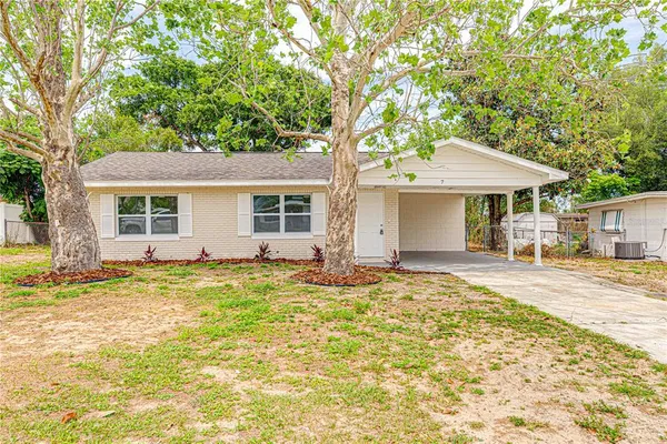 a house with trees in the background