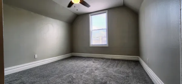 a view of an empty room and window