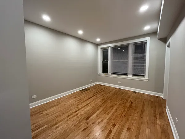 a kitchen with stainless steel appliances granite countertop a refrigerator a sink and a stove
