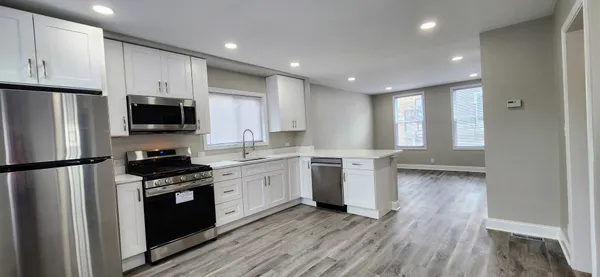 a view of kitchen with wooden floor