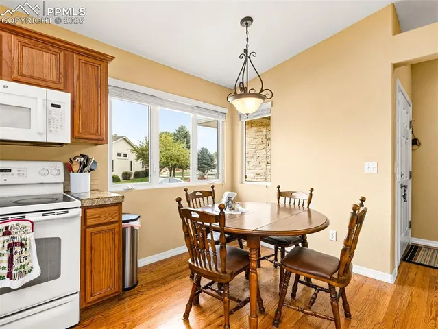 a view of a dining room with furniture window and outside view