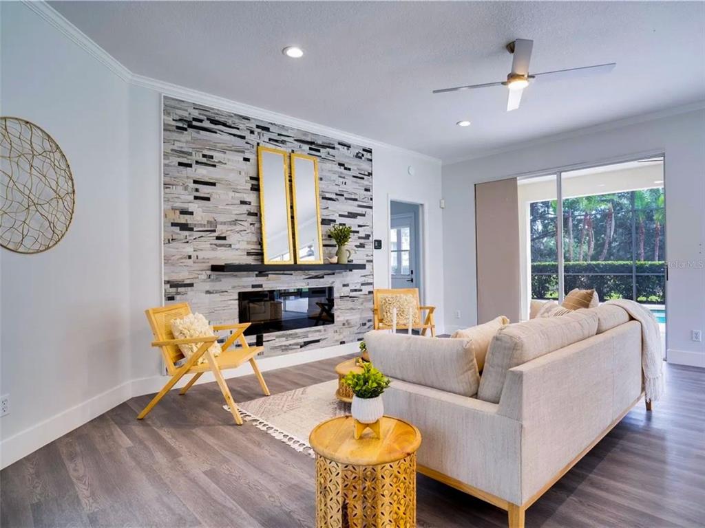 7724 US Open Loop Lakewood Ranch, FL 34202 - Photo 11 of 40 a living room with furniture and a large window
