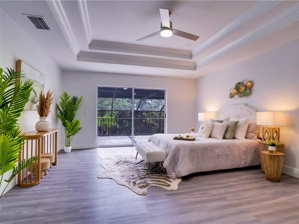 7724 US Open Loop Lakewood Ranch, FL 34202 - Photo 16 of 40 a living room with furniture and a large window
