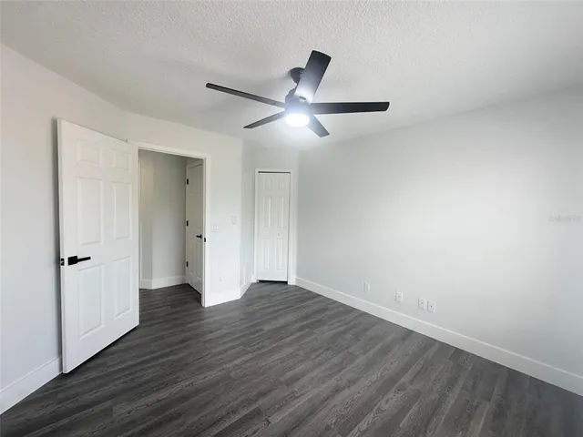 a view of an empty room and wooden floor