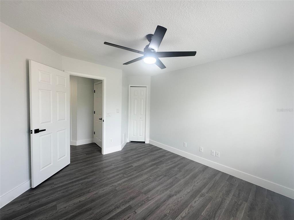 7724 US Open Loop Lakewood Ranch, FL 34202 - Photo 26 of 40 a view of an empty room and wooden floor