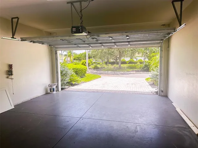 a view of empty room with window and front door