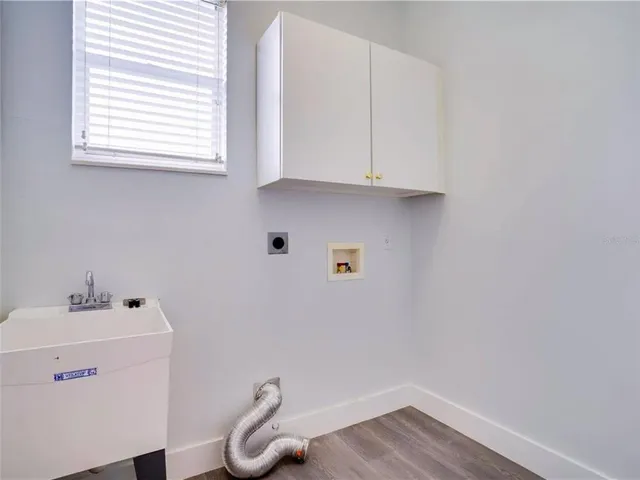 a bathroom with a sink and a window