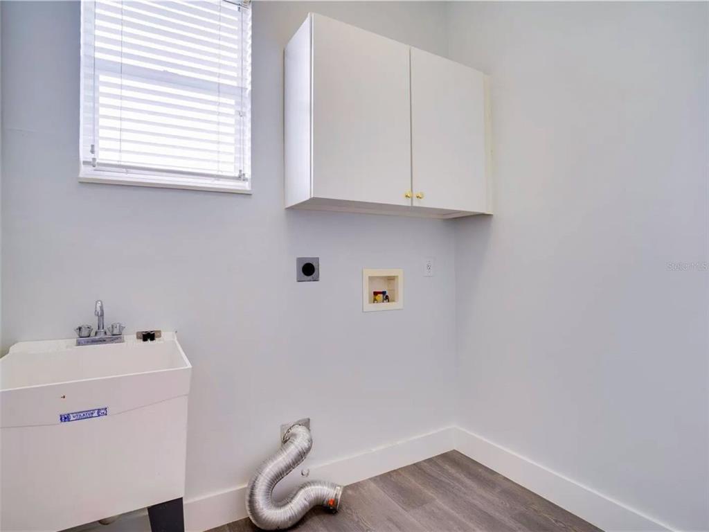 7724 US Open Loop Lakewood Ranch, FL 34202 - Photo 32 of 40 a bathroom with a sink and a window