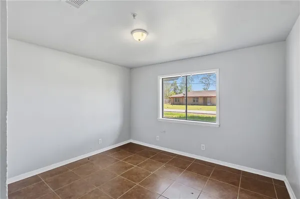 a view of an empty room with a window