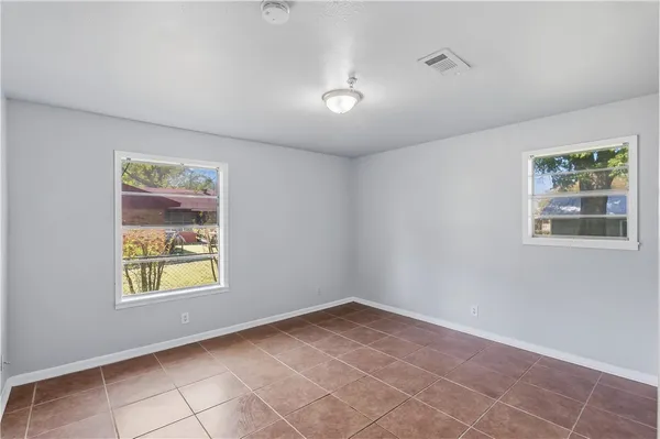 a view of an empty room with windows