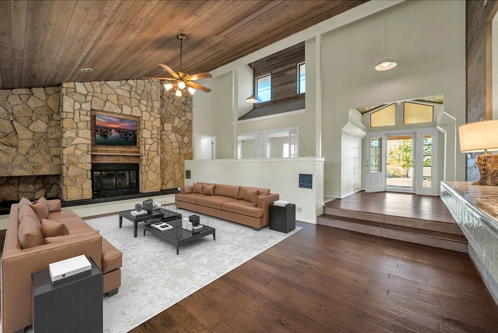 16753 Rolling Hills Lane Forney, TX 75126 - Photo 6 of 32 a living room with furniture and a fireplace