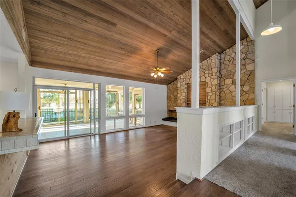 a view of an entryway with wooden floor